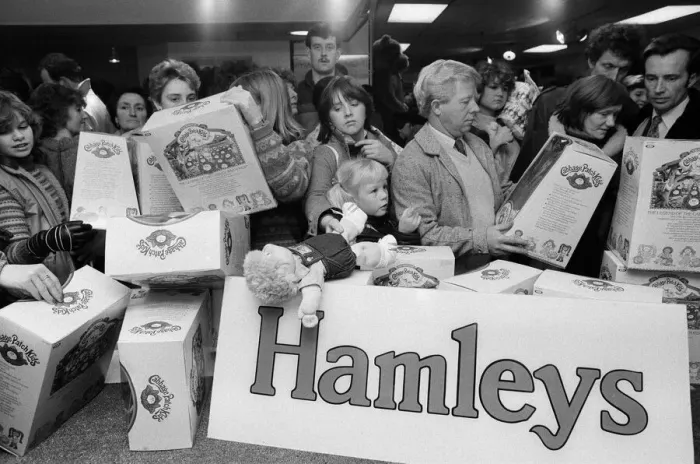 Framed Print : Shoppers buying Cabbage Patch Dolls at Hamleys, London toy store. 3rd December 1983