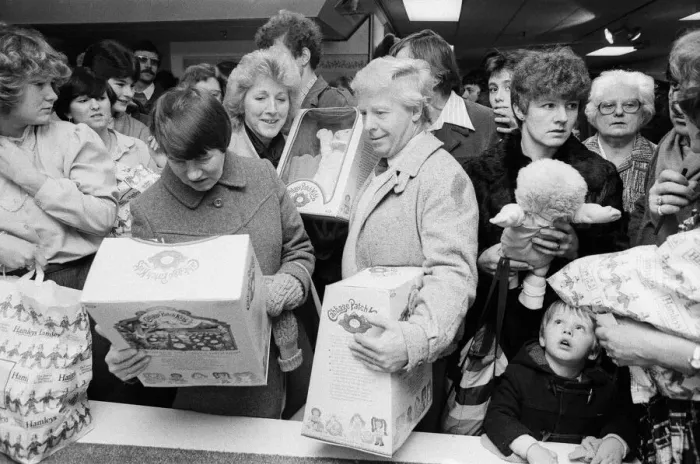 Framed Print : Shoppers buying Cabbage Patch Dolls at Hamleys, London toy store. 3rd December 1983