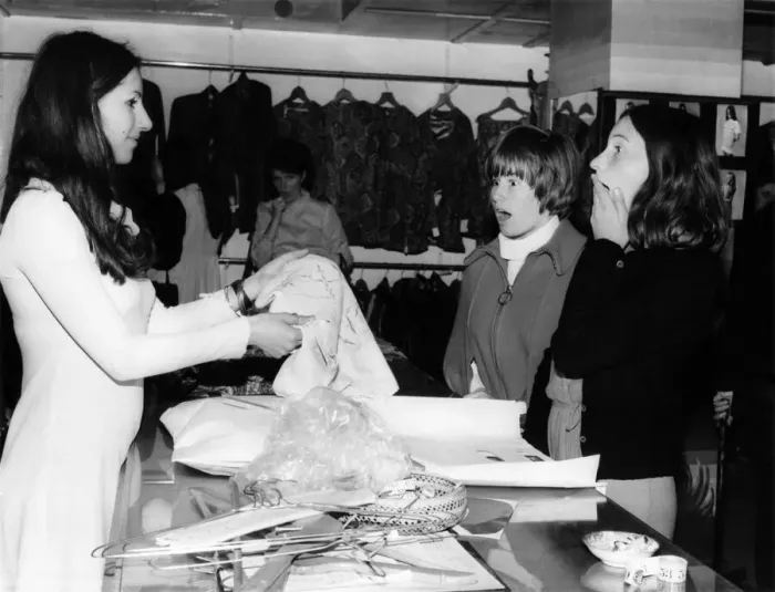 Framed Print : Shoppers are stunned when told clothes are free at the Apple Boutique close down sale