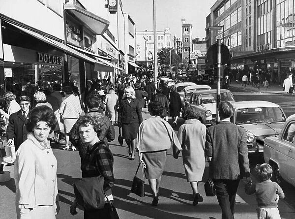 Shoppers in Swanseas main streets in search of bargains. 15th October 1965