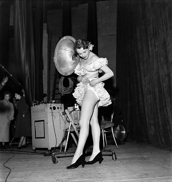 Showgirls performing on stage at a theatre. January 1953 D493-001
