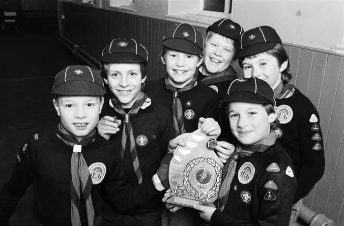 Framed Print : Showing off the shield they won in a five-a-side football competition are these members