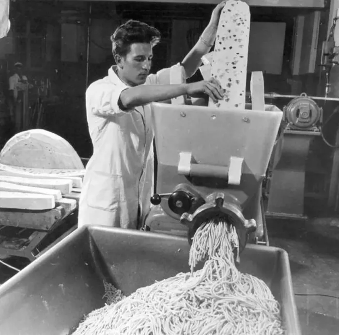  : Shredding Emmental cheese for processing at Roethlisberger and Son, Langhau, Switzerland