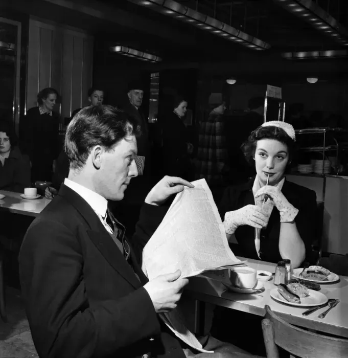 Framed Print : Shy boy and girl sitting together to have lunch in a canteen