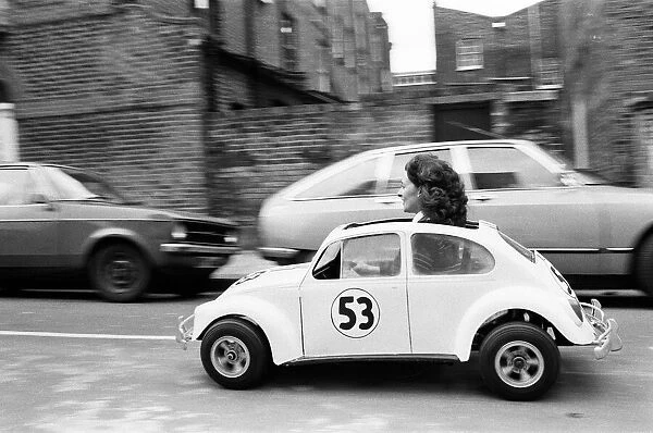 Sian Lloyd, who works at Walt Disney Productions, driving a replica of Herbie in Primrose