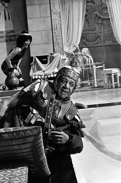 Sid James on the set of 'Carry on Cleo'at Pinewood Studios, Buckinghamshire