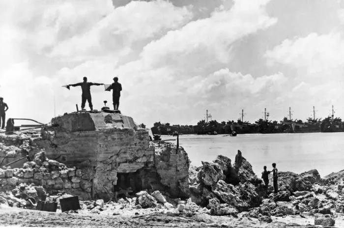 Framed Print : US Signalman directs landing ships off Okinawa Beach. A US Navy Signalman Framed Print : US Signalman directs landing ships off Okinawa Beach. A US Navy Signalman