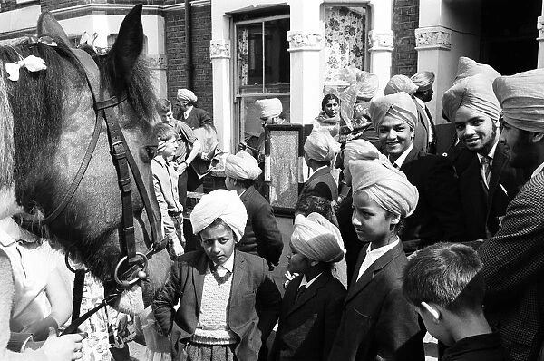 Sikh groom makes traditional departure, on a horse, for his wedding