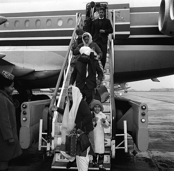 Sikh immigrants arriving in UK at Heathrow February 1970 from Kenya disembarking