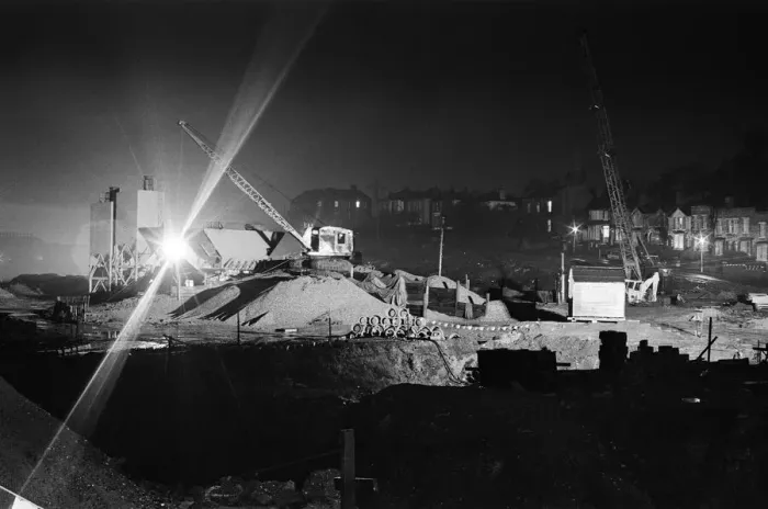 Framed Print : Silent cranes reach over what is usually a scene of intense activity by day - the site of Framed Print : Silent cranes reach over what is usually a scene of intense activity by day - the site of