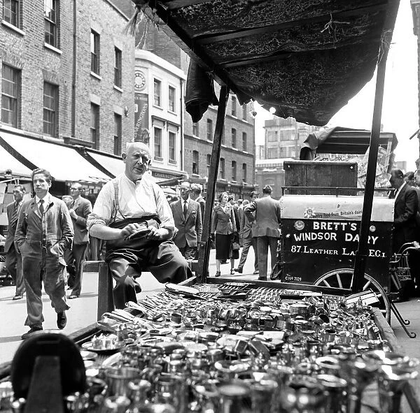 Silversmith stall during the down to earth market in Leather Lane in Holborn. Circa 1954