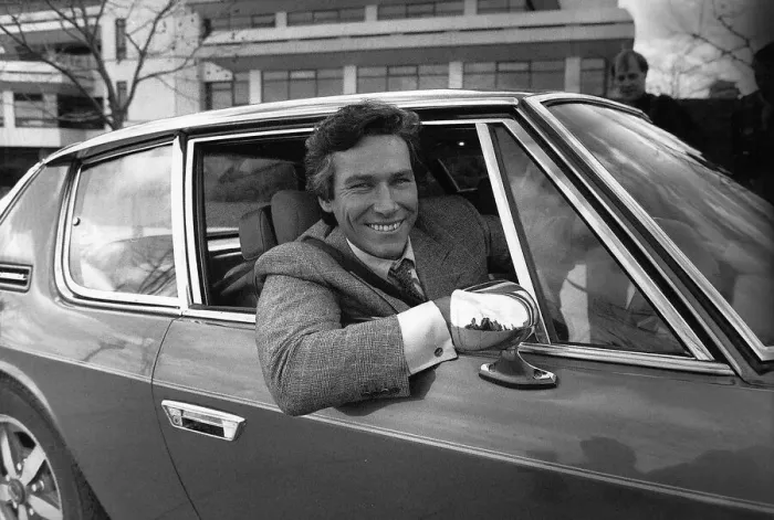Framed Print : Simon Dutton Actor leans out of the window of an Aston Martin DBS March 1989