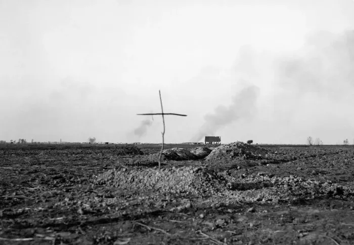Framed Print : A simple cross marks the spot of a grave of a Belgian soldier killed during the fighting