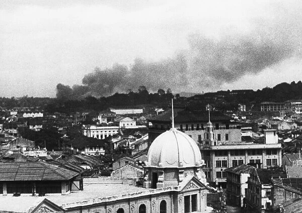 Singapore during a Japanese air raid during Second World War. 26th February 1942