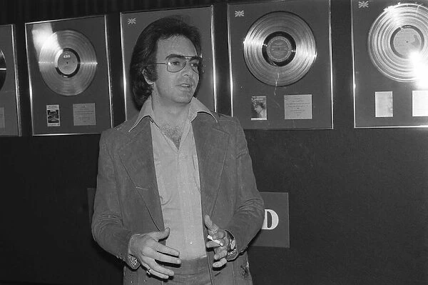 Singer and actor Neil Diamond. Disc on wall Cigarette June 1977
