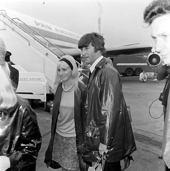 Singer with the Beatles John Lennon with wife Cynthia Lennon arriving at London Airport