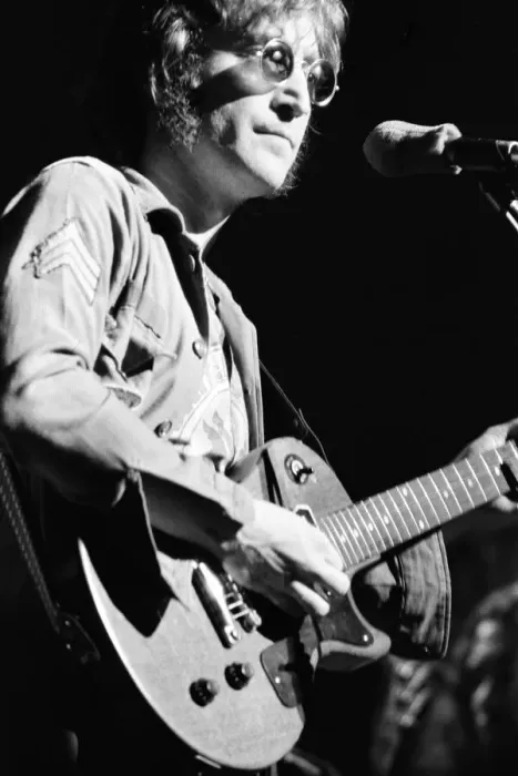 Framed Print : Former singer of The Beatles pop group John Lennon pictured performing on stage during Framed Print : Former singer of The Beatles pop group John Lennon pictured performing on stage during