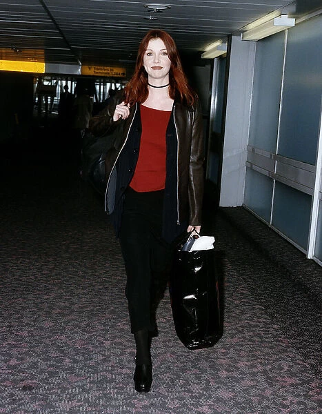 Singer Cathy Dennis arrives at Heathrow airport. 24th March 1993