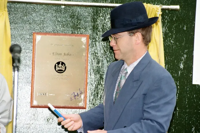 Framed Print : Singer Elton John unveils a plaque to mark the start of work on the AIDS clinic centre Framed Print : Singer Elton John unveils a plaque to mark the start of work on the AIDS clinic centre