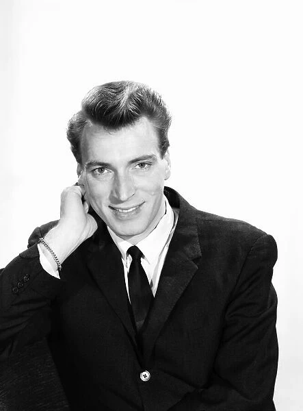 Singer Frank Ifield seen here posing for the Reveille newspaper for a fashion feature
