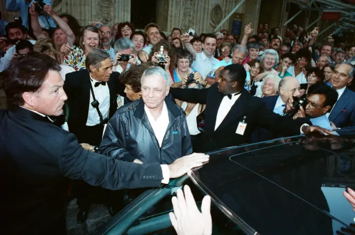 Framed Print : Singer Frank Sinarta is mobbed by waiting fans as he arrives at the Royal Albert Hall to Framed Print : Singer Frank Sinarta is mobbed by waiting fans as he arrives at the Royal Albert Hall to