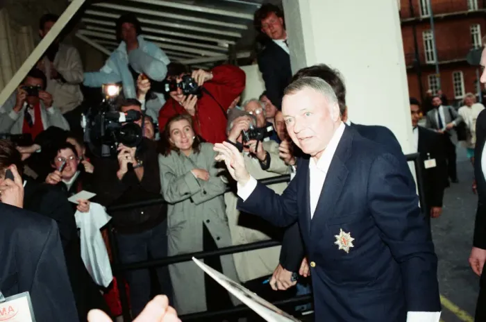 Framed Print : Singer Frank Sinarta is mobbed by waiting fans as he arrives at the Royal Albert Hall to