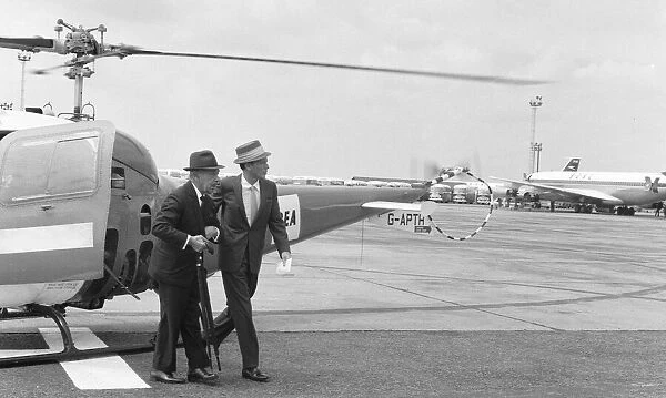 Singer Frank Sinatra seen here arriving at Heathrow Airport by helicopter