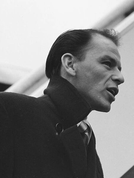 Singer Frank Sinatra seen here about to board a TWA flight to New York at London Airport