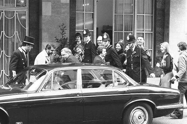 Singer Frank Sinatra seen here leaving Claridges Hotel amid high security