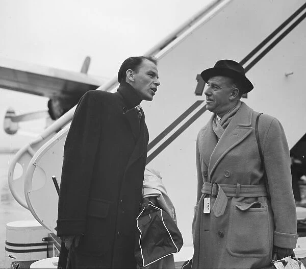 Singer Frank Sinatra seen here with Sunday People journalisrt Arthur Helliwell about to