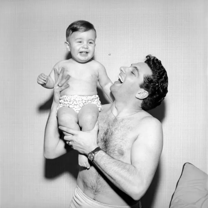 Framed Print : Singer Frankie Vaughan seen here playing with his son David. Circa 1957 Framed Print : Singer Frankie Vaughan seen here playing with his son David. Circa 1957