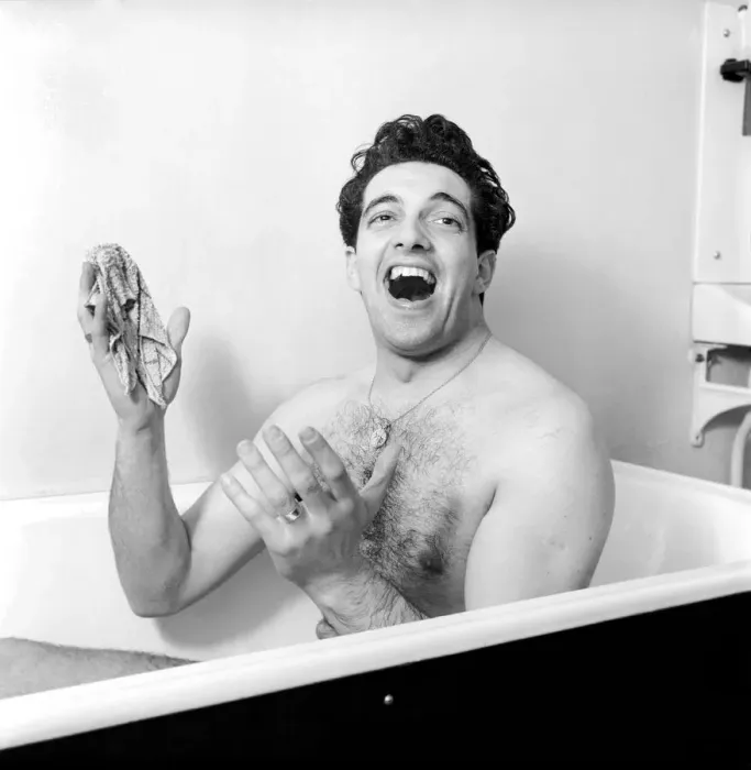 Framed Print : Singer Frankie Vaughan seen here singing in the bath at the family home. Circa 1957