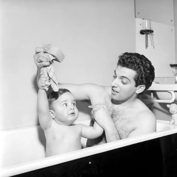 Framed Print : Singer Frankie Vaughan seen here taking a bath with his son David. Circa 1957 Framed Print : Singer Frankie Vaughan seen here taking a bath with his son David. Circa 1957