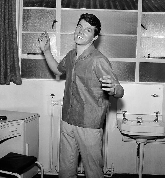 Singer Jess Conrad models a new paper shirt by Teddy Tinling. 12th February 1962
