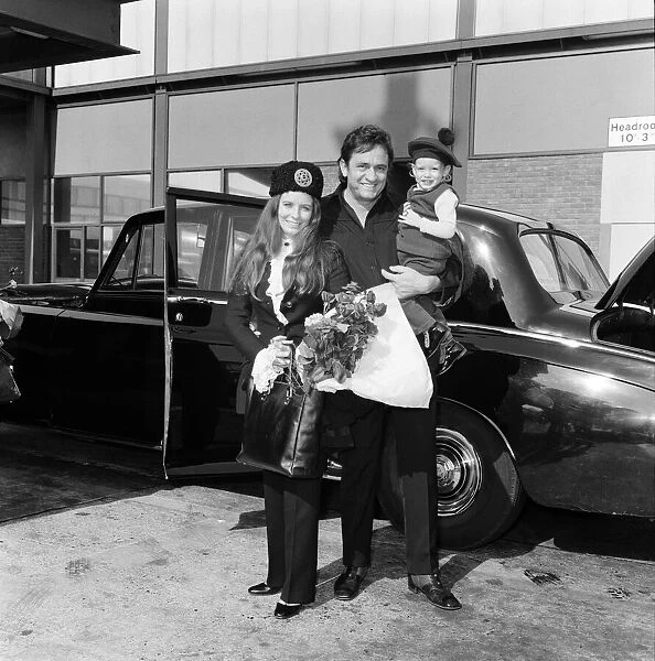 Singer Johnny Cash arrives at Heathrow Airport from Manchester with his wife June Carter