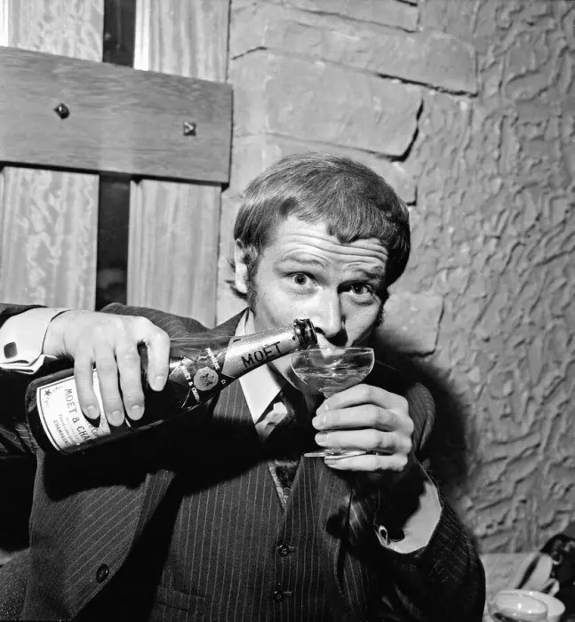 Framed Print : Singer Long John Baldry celebrates doing to the top of the charts with a bottle of Framed Print : Singer Long John Baldry celebrates doing to the top of the charts with a bottle of