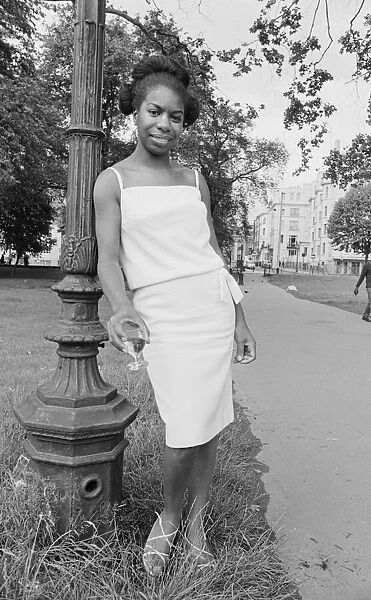 Singer Nina Simone stands besides a lampost in Hyde Park before a press reception held