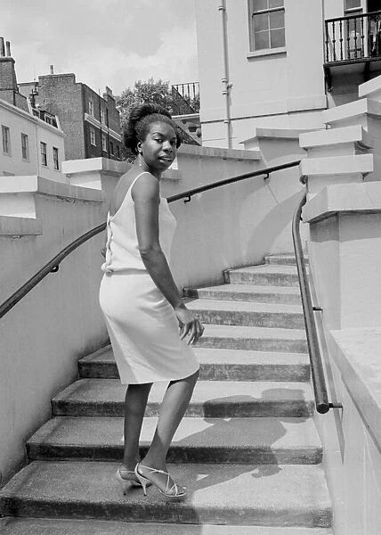 Singer Nina Simone stands on the steps of Philips record company building at Stanhope