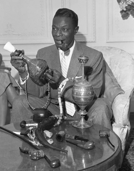Framed Print : Singer and pipe collector Nat King Cole seen here with his collection of pipes in his Framed Print : Singer and pipe collector Nat King Cole seen here with his collection of pipes in his