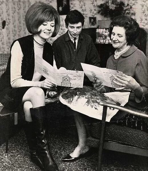 Singer and presenter Cilla Black with her brother and her mum at their home above George