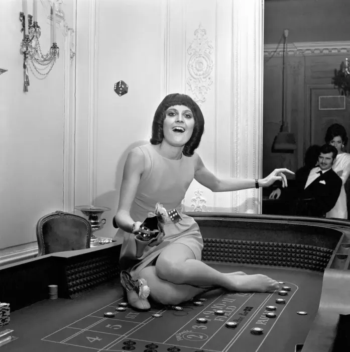Framed Print : Singer Sandie Shaw has a flutter at a party she gave for shoe-retailers attending Framed Print : Singer Sandie Shaw has a flutter at a party she gave for shoe-retailers attending