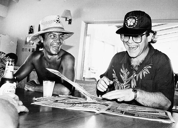 Singer and songwriter Elton John with his co-star lyricist Bernie Taupin seems happy once