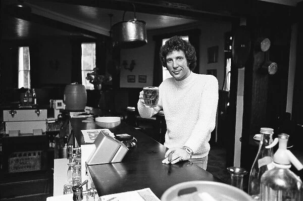Singer Tom Jones has a quiet drink at his local in Weybridge after missing fans at