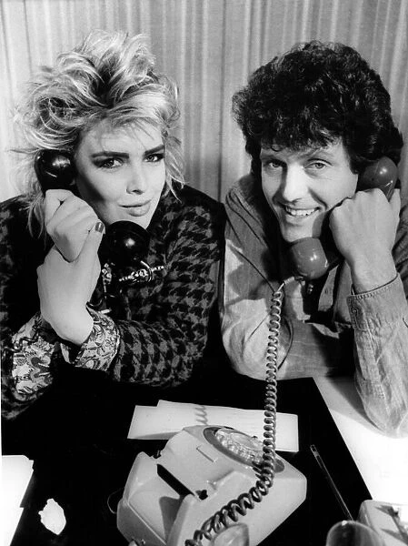 Singers Alvin Stardust and Kim Wilde man the telephones at the television studios 6