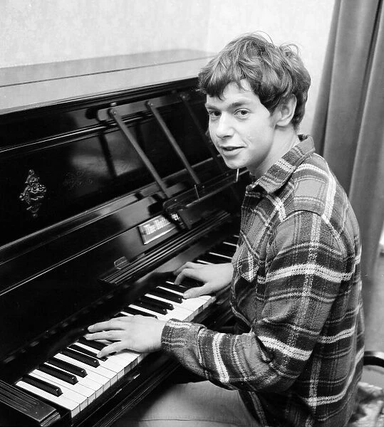 Singr Ian Whitcombe pictured at home on his piano. 11th March 1965