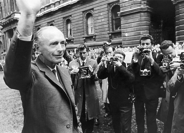 Sir Alec Douglas Home faces a battery of cameras on his return from Buckingham Palace