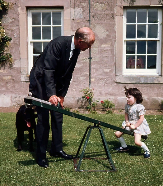 Sir Alec Douglas Home playing with his grand-daughter 1973