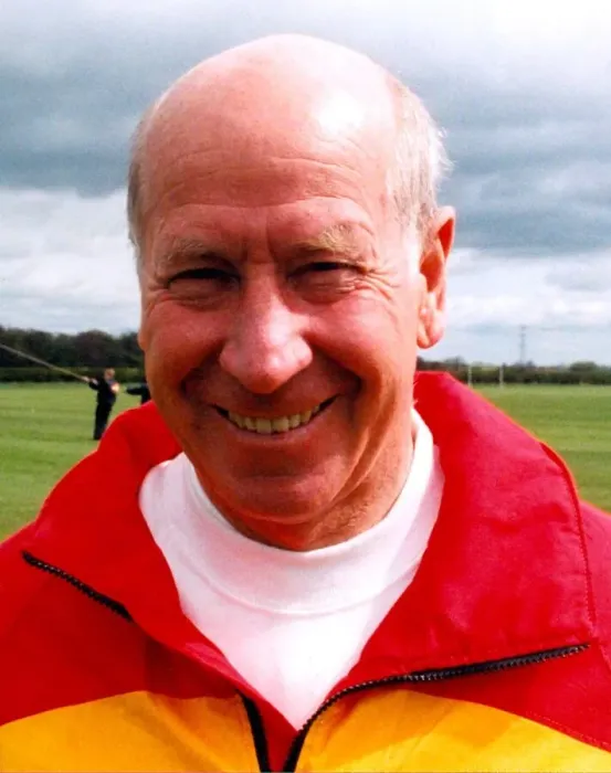 Framed Print : Sir Bobby Charlton gives tips to youngsters on Bullocksteads Sports Ground in May 1996 in