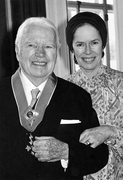 Sir Charles and Lady Cona Chaplin when he received his knighthood from the Queen
