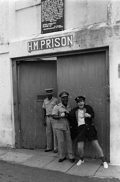 Sir Elton John pictured outside the jail in the West Indies on the Island of Monstserrat